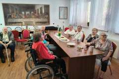 Spoločné posedenie pri harmonike